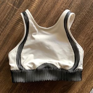 Alo Yoga Sports Bra. Women’s M. High neck and beige with black trim.